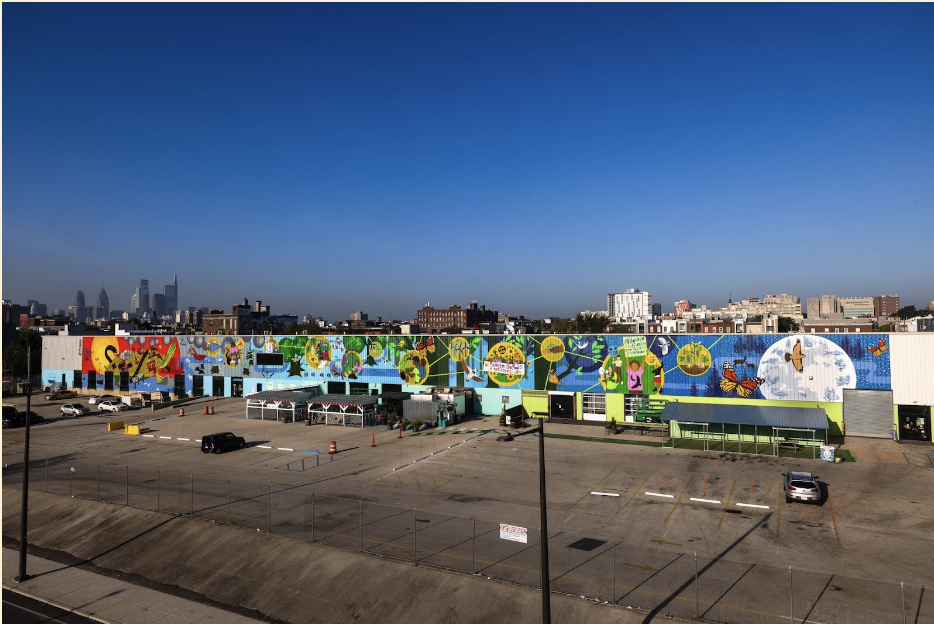 Climate Justice in Lenapehoking (2023). By Eurhi Jones. Mural Arts Philadelphia Collection. Courtesy: Steve Weinik, Climate Justice in Lenapehoking © 2023 City of Philadelphia Mural Arts Program / Eurhi Jones, 1800 North American Street. Photo by Steve Weinik.